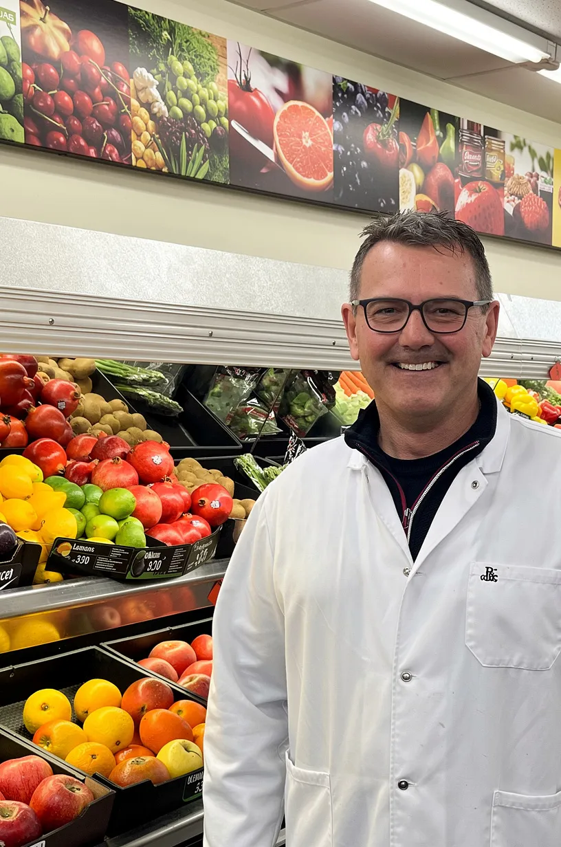 Owner Carmen Cornelius in the produce department
